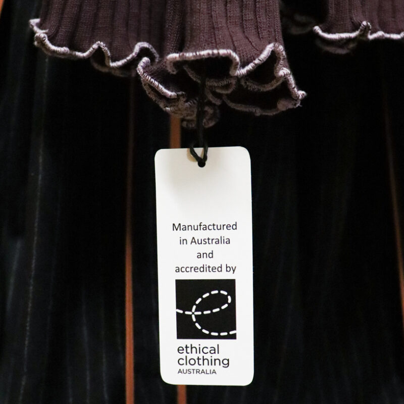 Ethical Clothing Australia tags on dark clothing